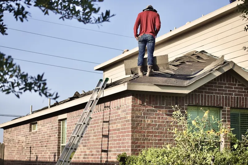 Professional roofer working on a residential roof in Downtown San Bernardino